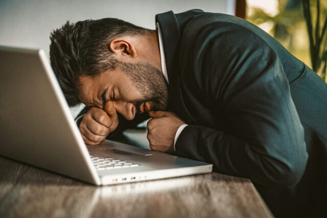Tired Business Man Sleeping At Notebook Overcoming Sleep Problems