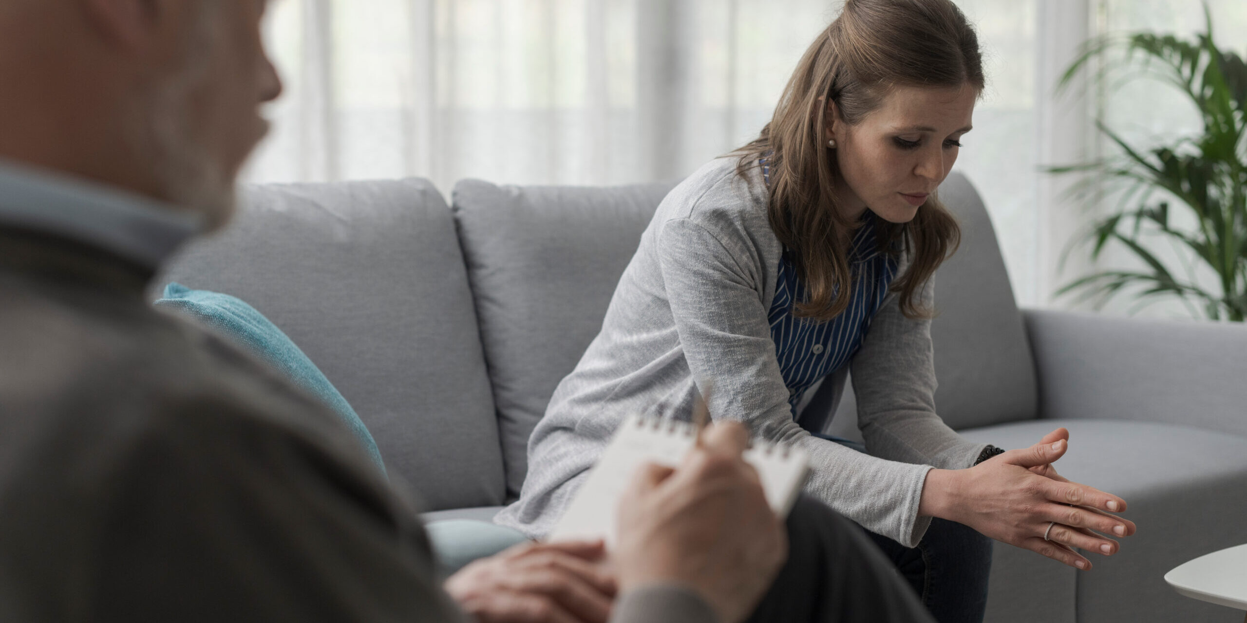 Depressed woman talking during a therapy session ADHD in Adults