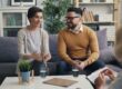 Counselor speaking with a couple in a warm office - christian marriage counseling resources