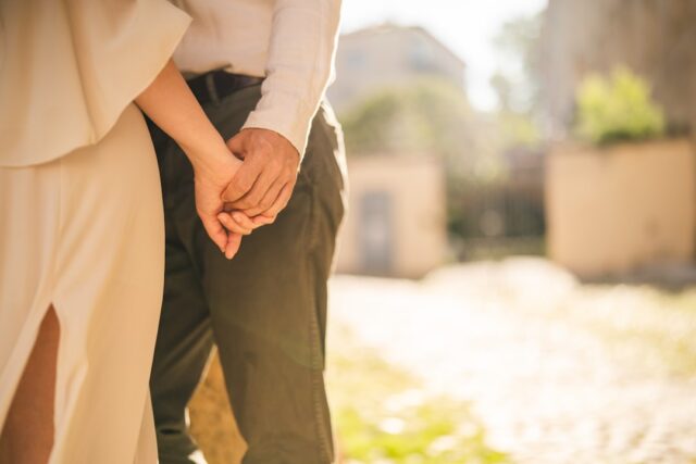 Christian couple praying together in warm light, faith and relationship healing