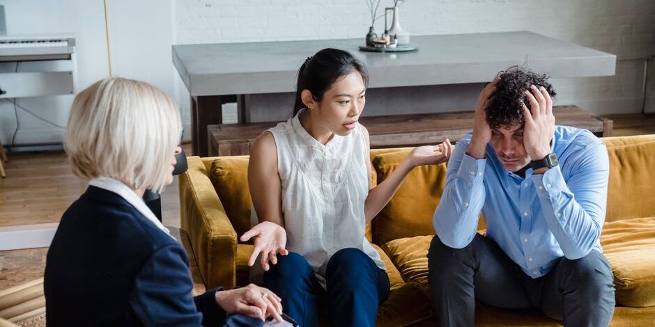 Christian therapy for broken marriages, couple sitting together looking hopeful