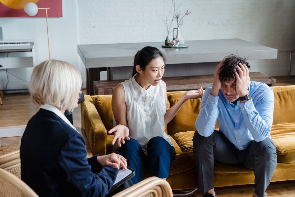Christian therapy for broken marriages, couple sitting together looking hopeful