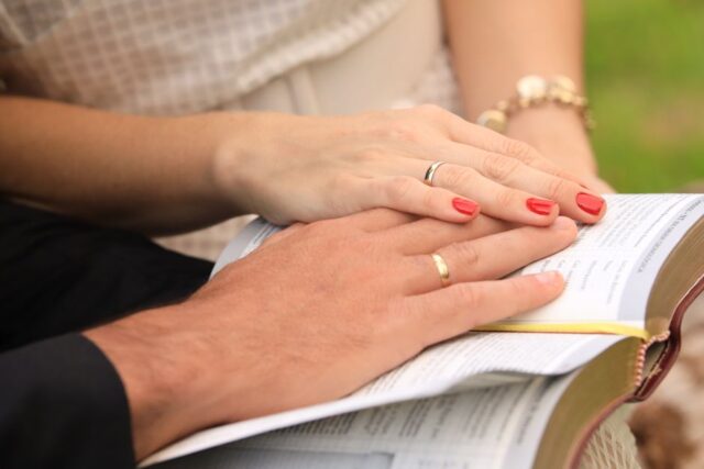 engaged Christian couple praying